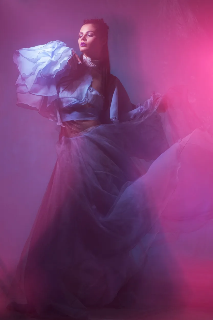 Editorial model in a dramatic flowing dress